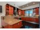 Modern kitchen with custom cabinets, stainless steel appliances, granite countertops, and ample natural light at 180 N Cook St # 509, Denver, CO 80206