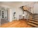 Inviting living room featuring hardwood floors, a sculptural staircase, and stylish decor at 180 N Cook St # 509, Denver, CO 80206
