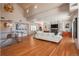 Open living space with modern decor, a stone fireplace, and lots of natural light at 180 N Cook St # 509, Denver, CO 80206
