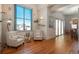 Inviting living room with hardwood floors, large windows, and ample seating, ideal for relaxing and entertaining at 180 N Cook St # 509, Denver, CO 80206