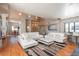 Bright, open living room featuring hardwood floors, modern furnishings, and an abundance of natural light at 180 N Cook St # 509, Denver, CO 80206