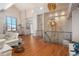 Open-concept living room showcasing high ceilings, hardwood floors, and stylish chandeliers at 180 N Cook St # 509, Denver, CO 80206
