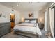 Cozy main bedroom with a comfortable bed, soft lighting, and ensuite bathroom access at 180 N Cook St # 509, Denver, CO 80206