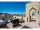 Private patio with deck chairs and a grill; perfect for entertaining at 180 N Cook St # 509, Denver, CO 80206