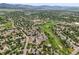 Expansive aerial perspective of well-planned community with abundant green spaces and mountain views at 10349 W Fair Ave # A, Littleton, CO 80127