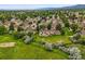 Beautiful aerial view of well-kept townhomes surrounded by lush greenery and open spaces at 10349 W Fair Ave # A, Littleton, CO 80127