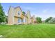 A large grassy backyard for a multi-Gathering home with a covered patio area at 10349 W Fair Ave # A, Littleton, CO 80127