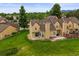 Aerial backyard shot of a multi-Gathering home with mature landscaping, lawn, and patio at 10349 W Fair Ave # A, Littleton, CO 80127