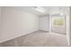 A carpeted basement with a large closet and a window for natural light at 10349 W Fair Ave # A, Littleton, CO 80127