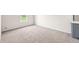 Bedroom with neutral carpet, light walls, base trim and natural light from a window at 10349 W Fair Ave # A, Littleton, CO 80127