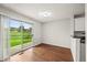 Dining room with sliding glass doors leading to outdoor green space at 10349 W Fair Ave # A, Littleton, CO 80127