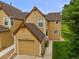 Lovely townhome showcasing a single-car garage and neat, green lawn at 10349 W Fair Ave # A, Littleton, CO 80127