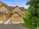Attractive townhome featuring a one-car garage and well-maintained landscaping at 10349 W Fair Ave # A, Littleton, CO 80127