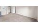 Bedroom with neutral carpet, light walls and an ensuite bathroom with walk-in closet at 10349 W Fair Ave # A, Littleton, CO 80127