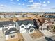 Areal view showcasing a home in a well-planned community with open spaces and modern architecture under a blue sky at 3976 Breakcamp Ct, Castle Rock, CO 80108