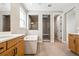 A luxurious bathroom boasts a soaking tub, separate shower, double vanity, and natural light at 3976 Breakcamp Ct, Castle Rock, CO 80108