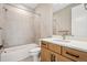 Bright bathroom features a shower-over-tub, stylish vanity with quartz countertop, and modern fixtures at 3976 Breakcamp Ct, Castle Rock, CO 80108