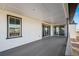 A covered outdoor deck is shown with sliding glass doors leading inside the house at 3976 Breakcamp Ct, Castle Rock, CO 80108