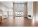 Open living space with a modern fireplace and balcony view, offering a sleek and inviting ambiance at 3976 Breakcamp Ct, Castle Rock, CO 80108