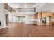 Bright, open-concept living space with wood floors, high ceilings, and a modern kitchen, perfect for entertaining at 3976 Breakcamp Ct, Castle Rock, CO 80108