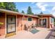 Inviting back porch with table and chairs perfect for outdoor relaxation and entertaining at 7284 Willa Ln, Evergreen, CO 80439