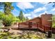 Private backyard with deck, wooden railing and stairs is a perfect spot to relax and enjoy outdoor living at 7284 Willa Ln, Evergreen, CO 80439