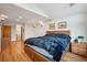 Serene main bedroom with wood floors and en-suite bathroom for added privacy at 7284 Willa Ln, Evergreen, CO 80439