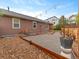 Spacious backyard with a gravel area, lush greenery, and well-maintained landscaping at 3838 Brush Rd, Castle Rock, CO 80108