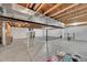 Unfinished basement space with exposed beams, concrete floor and plenty of room for storage and activities at 3838 Brush Rd, Castle Rock, CO 80108