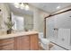 Bright bathroom featuring vanity, toilet, and glass door shower at 3838 Brush Rd, Castle Rock, CO 80108