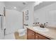 Bright bathroom featuring a shower with white curtain and a vanity with a wood cabinet at 3838 Brush Rd, Castle Rock, CO 80108