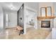 Welcoming entryway featuring a bench and coat rack, leading to a bright living space at 3838 Brush Rd, Castle Rock, CO 80108