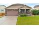 Charming single-Gathering home featuring stone accents, a well-manicured lawn, and a two-car garage at 3838 Brush Rd, Castle Rock, CO 80108