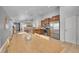 Open kitchen with stainless steel appliances, natural wood cabinets, and stone flooring at 3838 Brush Rd, Castle Rock, CO 80108
