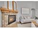 Comfortable living room featuring a stone fireplace and ample seating, creating a cozy atmosphere at 3838 Brush Rd, Castle Rock, CO 80108