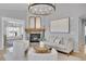 Inviting living room featuring a stone fireplace and modern furnishings, perfect for cozy evenings at 3838 Brush Rd, Castle Rock, CO 80108