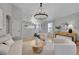 Bright living room with an elegant chandelier, neutral palette, and comfortable seating at 3838 Brush Rd, Castle Rock, CO 80108