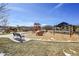 Community park and playground with slides, climbing dome, picnic shelter, and benches under sunny skies at 3838 Brush Rd, Castle Rock, CO 80108