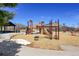 Community playground featuring a tire swing, slides and climbing structures with wood chip ground cover at 3838 Brush Rd, Castle Rock, CO 80108