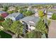 Aerial view of a home with mature landscaping, a large backyard, and neighborhood in the background at 13075 Tamarac St, Thornton, CO 80602