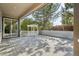 Expansive covered back deck with pergola, bench seating, wooden decking, and view of the fenced backyard at 13075 Tamarac St, Thornton, CO 80602