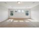 Bright bedroom features three windows providing ample natural light and plush carpet at 13075 Tamarac St, Thornton, CO 80602