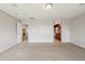 Spacious bedroom with carpet flooring and doorway to bathroom and other room at 13075 Tamarac St, Thornton, CO 80602