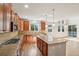 Updated kitchen featuring granite countertops, stainless appliances, and views to the backyard at 13075 Tamarac St, Thornton, CO 80602