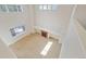 Bright, open living room with high ceilings, fireplace, and abundant natural light at 13075 Tamarac St, Thornton, CO 80602