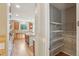 View of the kitchen and walk-in pantry with ample storage space and shelving at 13075 Tamarac St, Thornton, CO 80602