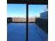 View through a glass door to a backyard covered in snow enclosed by a wooden fence at 473 N Banner St # C, Elizabeth, CO 80107