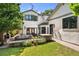 Spacious backyard with outdoor seating, stone accents, and lush landscaping at 852 Pontiac St, Denver, CO 80220
