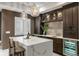 Wet bar boasts a quartz countertop, cabinetry, and a beverage refrigerator at 852 Pontiac St, Denver, CO 80220
