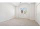 Clean bedroom with neutral carpet and a window with plantation shutters at 852 Pontiac St, Denver, CO 80220